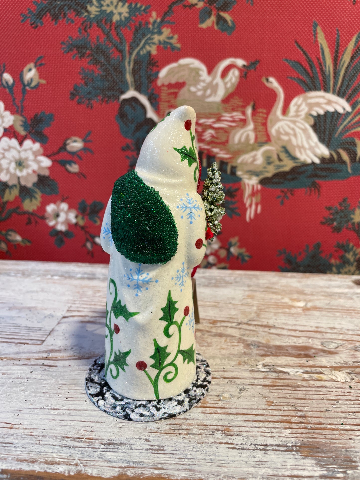 Cream Coat Santa Holding Tree | Ino Schaller