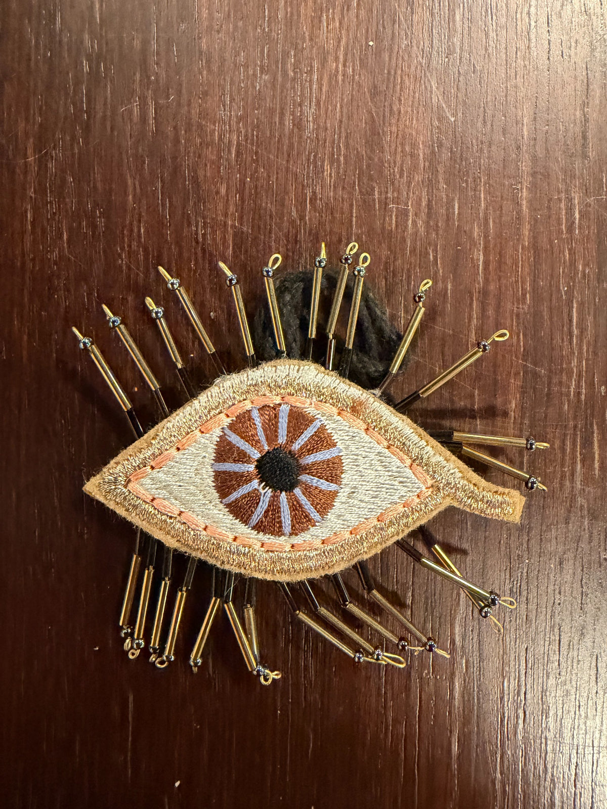 Ethereal Eye Beaded Christmas Ornament in Brown by Cody Foster — sold individually
