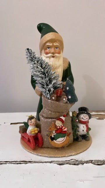 Santa Green Coat with Bag of Toys - Ino Schaller - Bon Ton goods