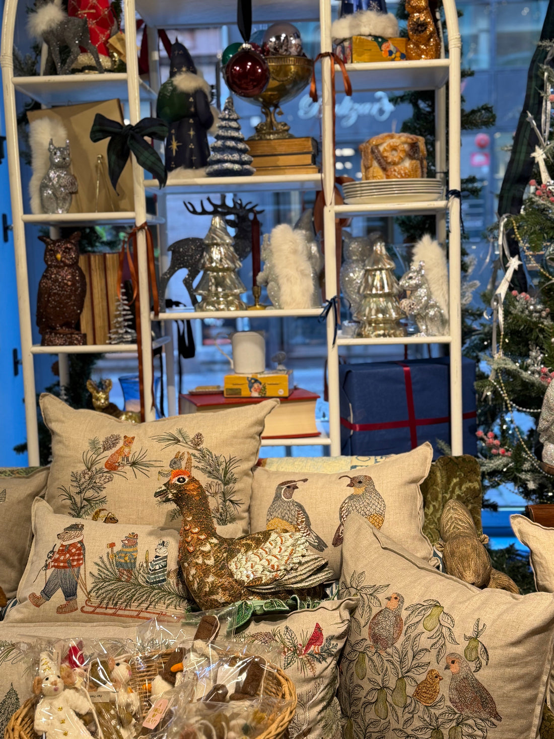 Christmas displays and embroidered cushions inside BON TON goods in Malmö
