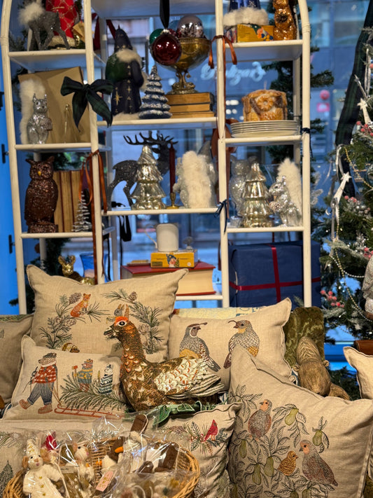 Christmas displays and embroidered cushions inside BON TON goods in Malmö