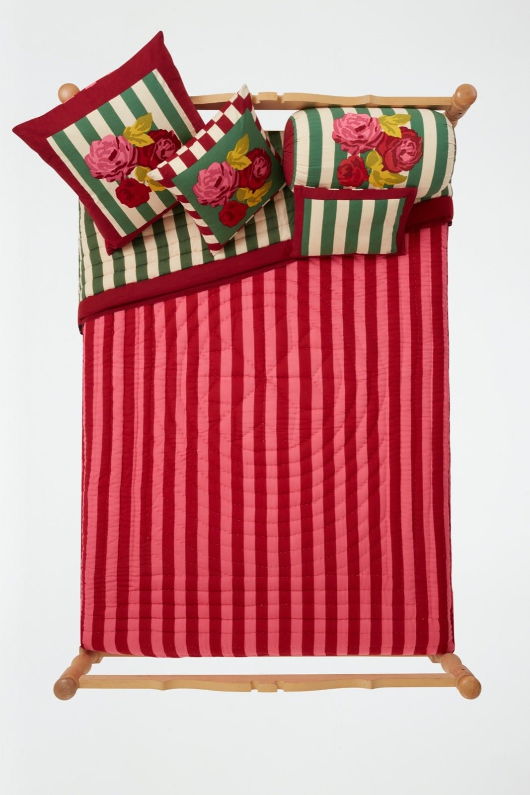 Lisa Corti Nizam Stripes Green Natural reversible quilt styled on a bed
