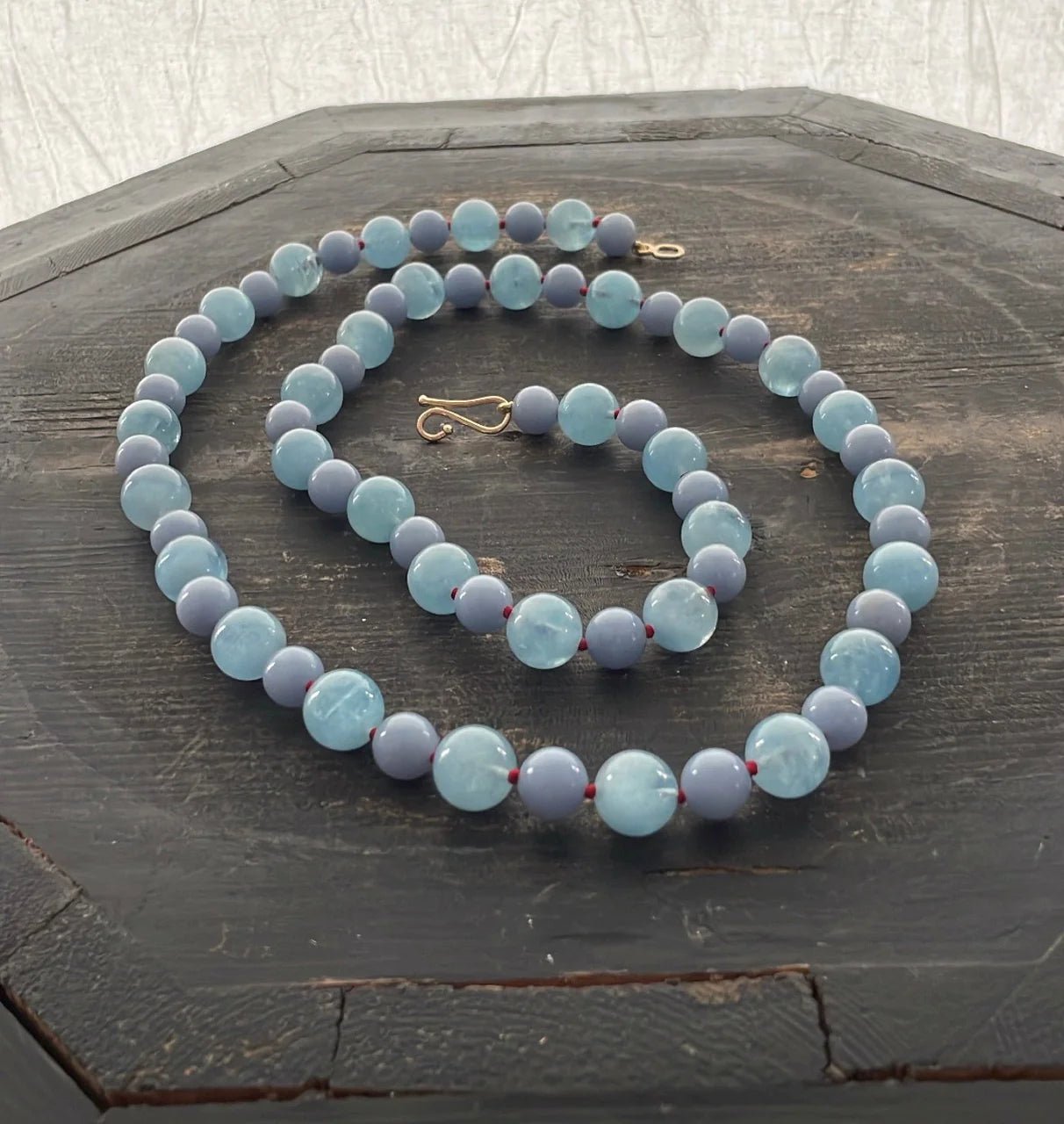 AQUAMARINE - The peaceful blue-green aquamarine symbolizes the tranquility of its oceanic namesake. Bon Ton goods