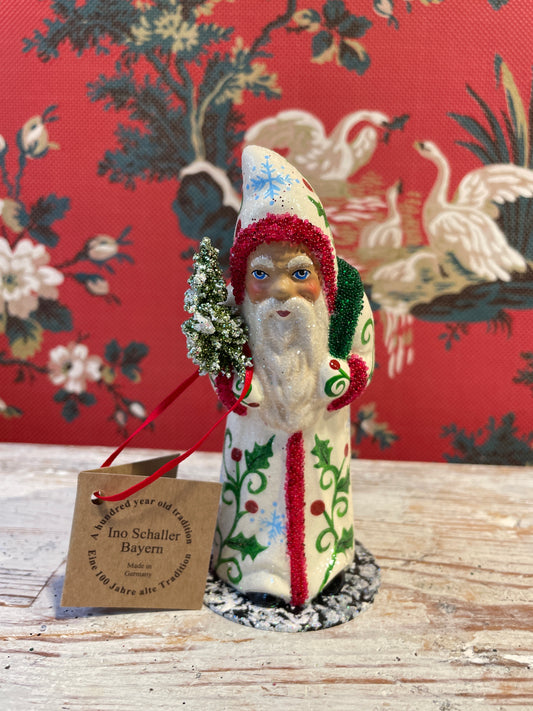 Cream Coat Santa Holding Tree | Ino Schaller