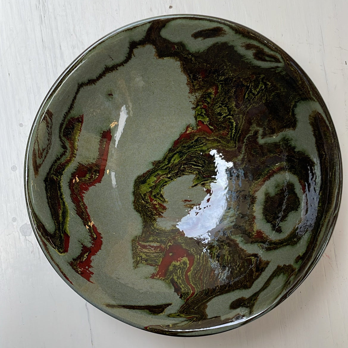 Ceramic bowl with artistic design on a white surface