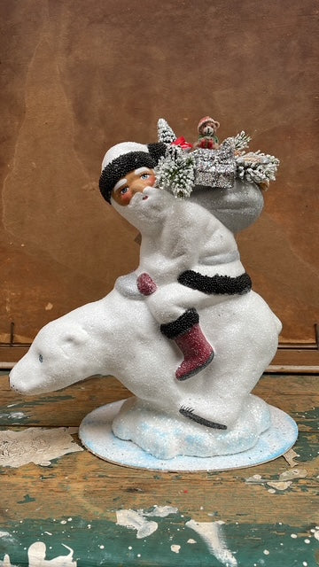 White Glitter Santa with Black Beaded Trim & Bag of Toys on Polar Bear | Ino Schaller