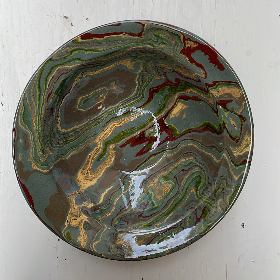 Marbled ceramic plate on a white surface