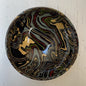 Marbled ceramic knob on a white wooden surface