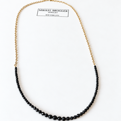 Mikkel Brøgger black diamond necklace with graduated black diamonds and 14k gold chain
