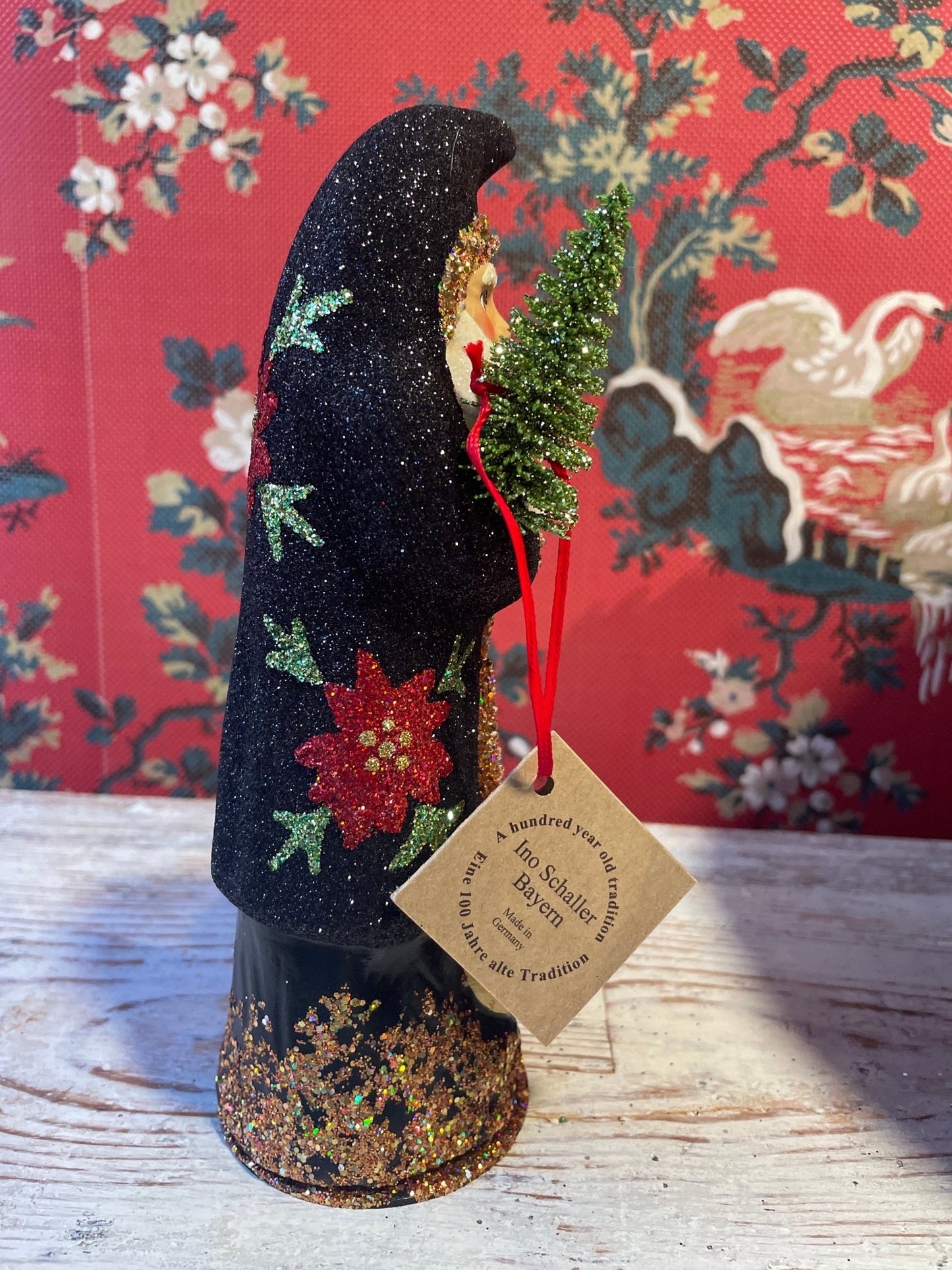 Black Glitter Santa With Poinsettia | Ino Schaller - Bon Ton goods