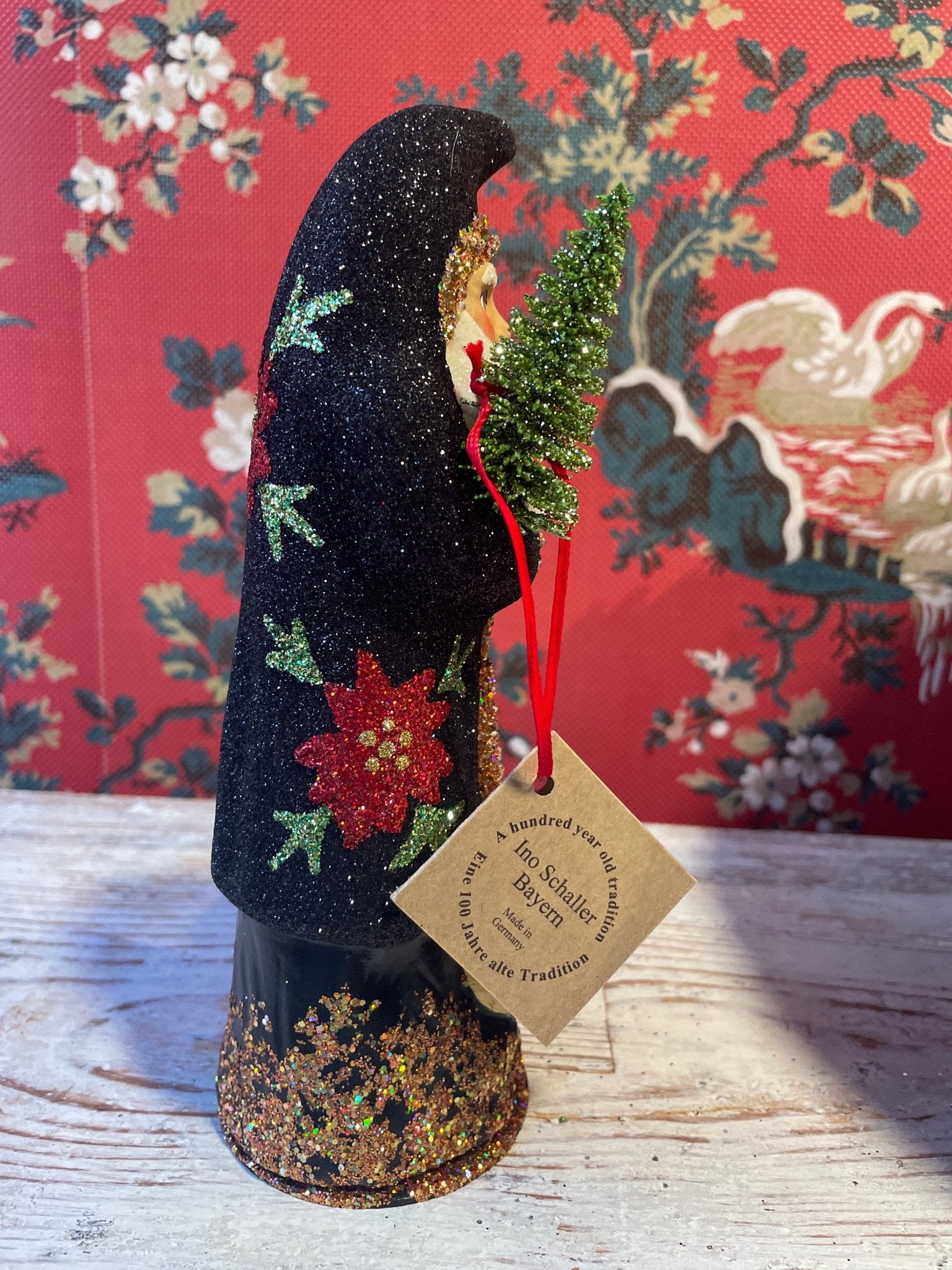 Black Glitter Santa With Poinsettia | Ino Schaller - Bon Ton goods