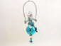 Blue Earmuff Child On Glass Ball | Vintage by Crystal Spun Cotton Ornament - Bon Ton goods