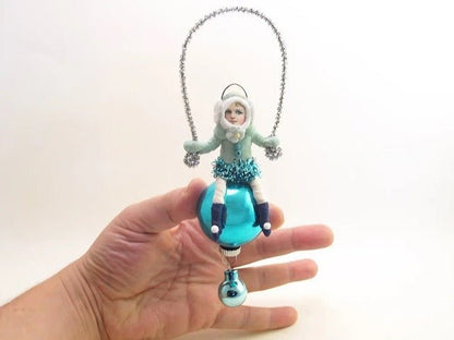 Blue Earmuff Child On Glass Ball | Vintage by Crystal Spun Cotton Ornament - Bon Ton goods