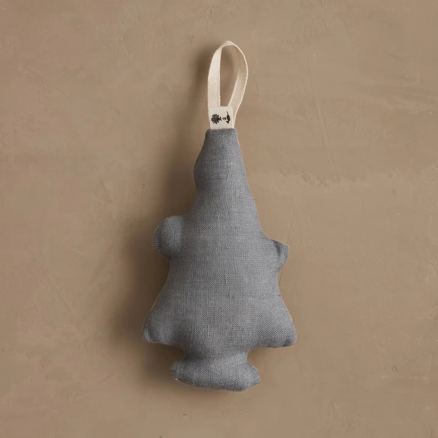 Solid grey linen back of the Christmas Tree Bear ornament