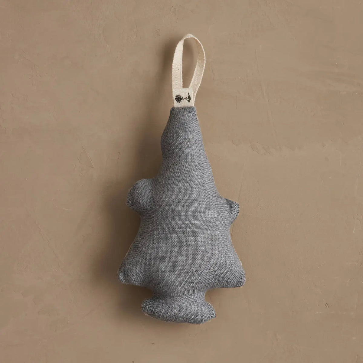 Solid grey linen back of the Christmas Tree Bear ornament