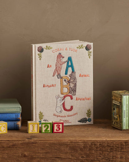 Coral & Tusk ABC book styled on a shelf