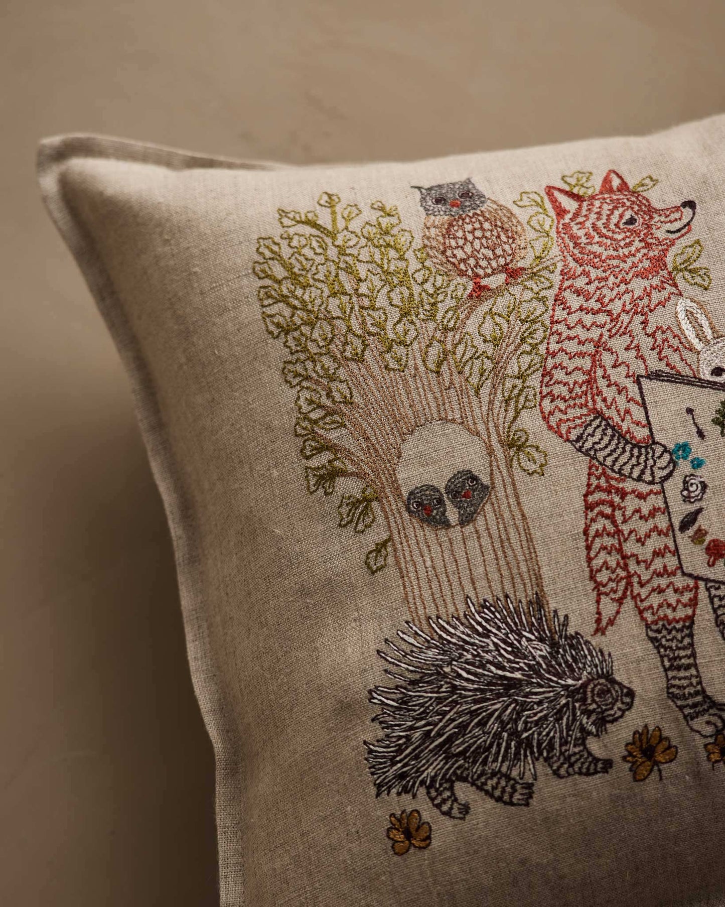 Detail crop of Coral & Tusk Storytime Pillow embroidery