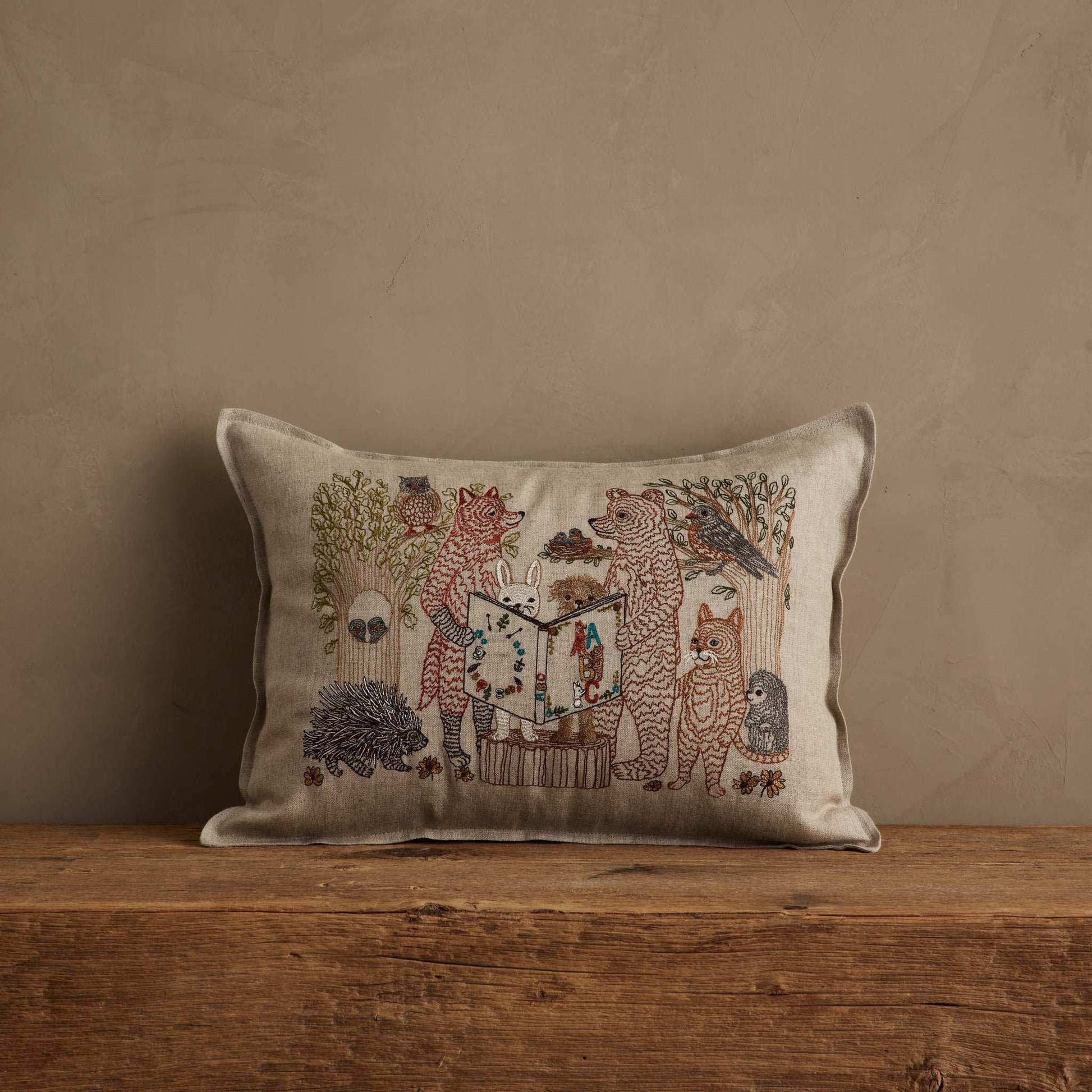 Coral & Tusk Storytime Pillow embroidered on natural linen