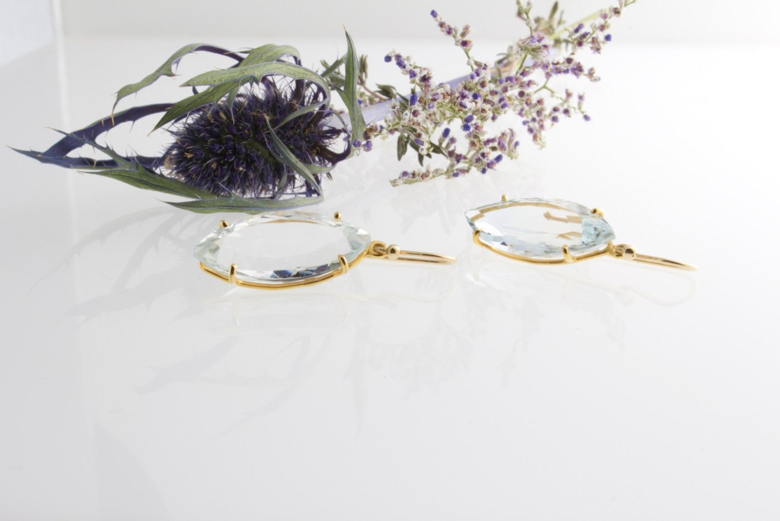 FACETED BLUE TOPAZ EARRINGS - Bon Ton goods