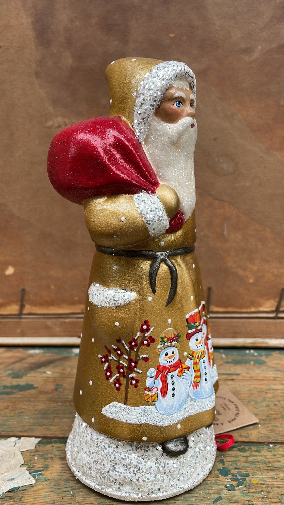 Golden Santa With Snowman Scene and Bright Red Bag | Ino Schaller - Bon Ton goods