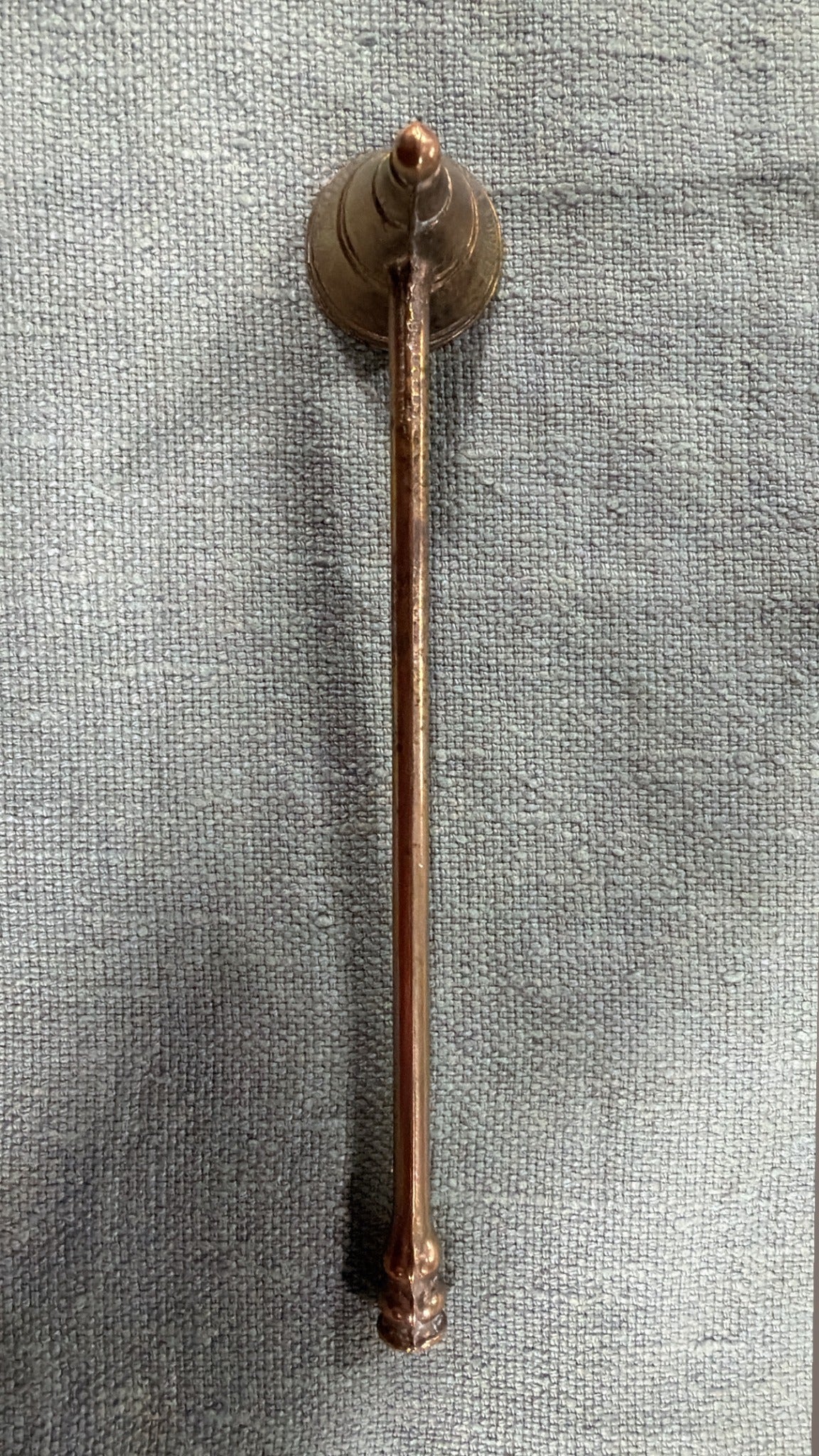 Vintage brass candle snuffer with tiered bell head and slender handle, 20 cm long