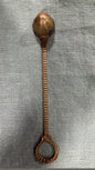 Vintage brass candle snuffer with rounded patterned head, ridged stem and open loop handle, 22 cm long