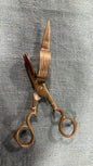 Vintage brass wick trimmer with fluted wick-catching box and curved loop handles, 17 cm long