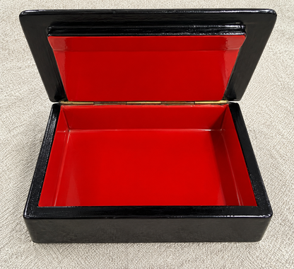 Open French wooden squirrel jewelry box showing its lacquered red interior